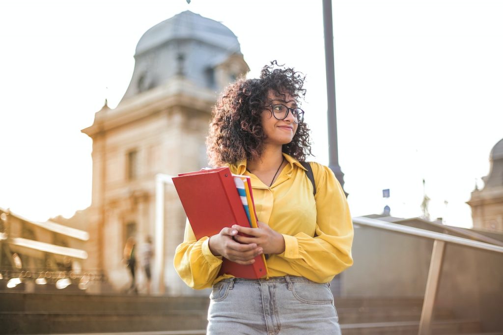 Photo by Andrea Piacquadio: https://www.pexels.com/photo/woman-in-yellow-jacket-holding-books-3762800/